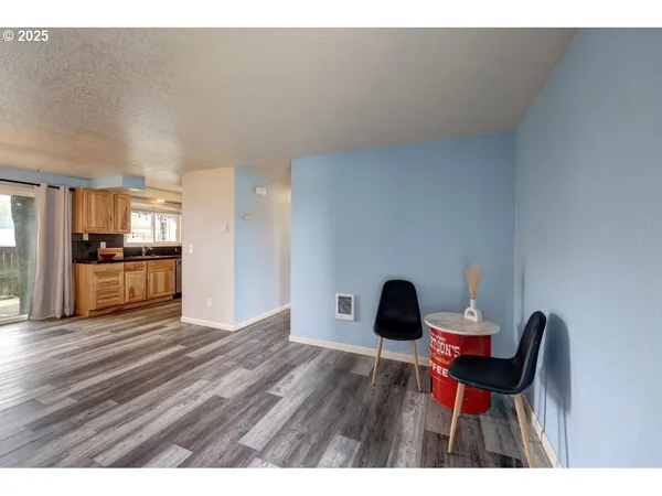 a view of an chairs and table in a room