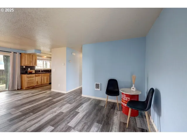 a view of an chairs and table in a room