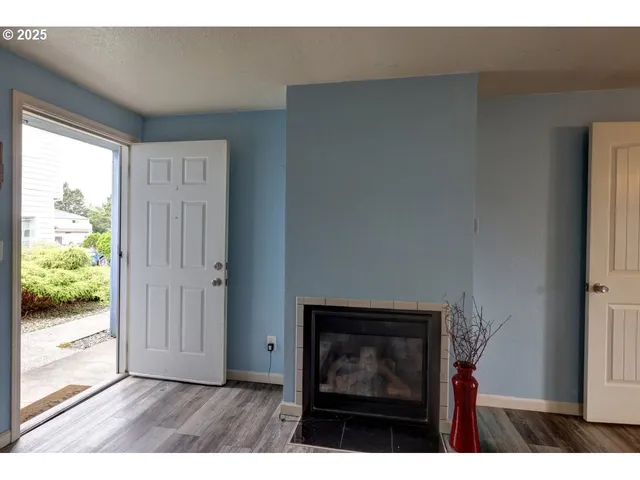 a view of an empty room and wooden floor
