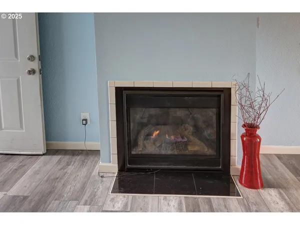 a view of wooden floor with a fireplace