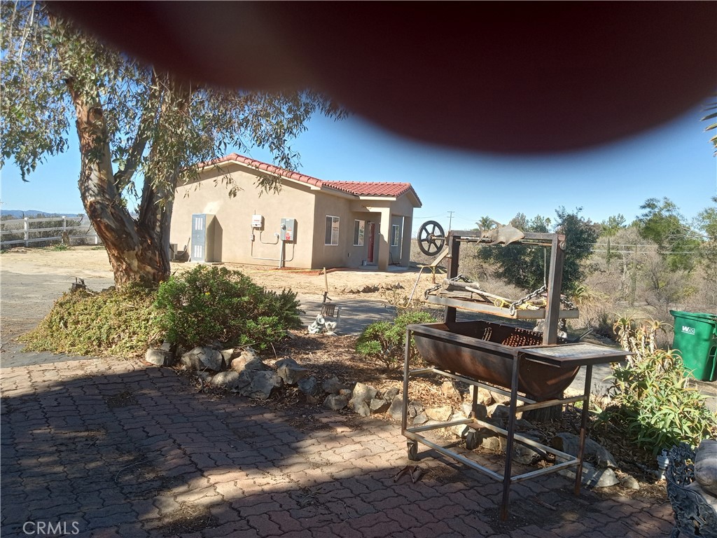 36248 Enterprise Temecula, CA 92592 - Photo 3 of 6 a front view of a house with garden