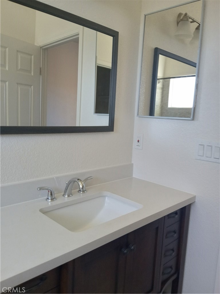36248 Enterprise Temecula, CA 92592 - Photo 4 of 6 a bathroom with a sink and a mirror