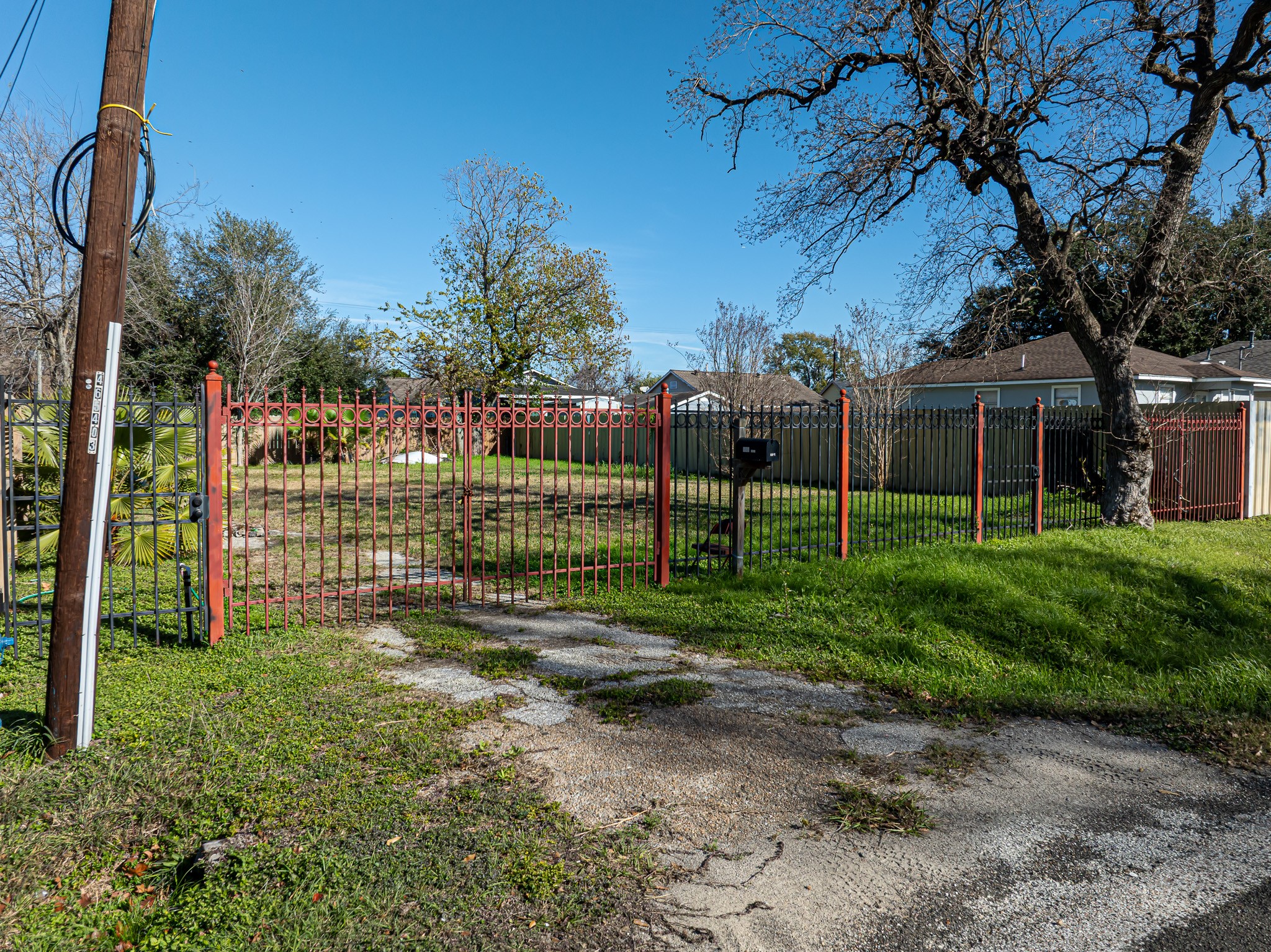 206 Oddo Street Houston, TX 77022 - Photo 4 of 18 a view of a house with a backyard and a tree