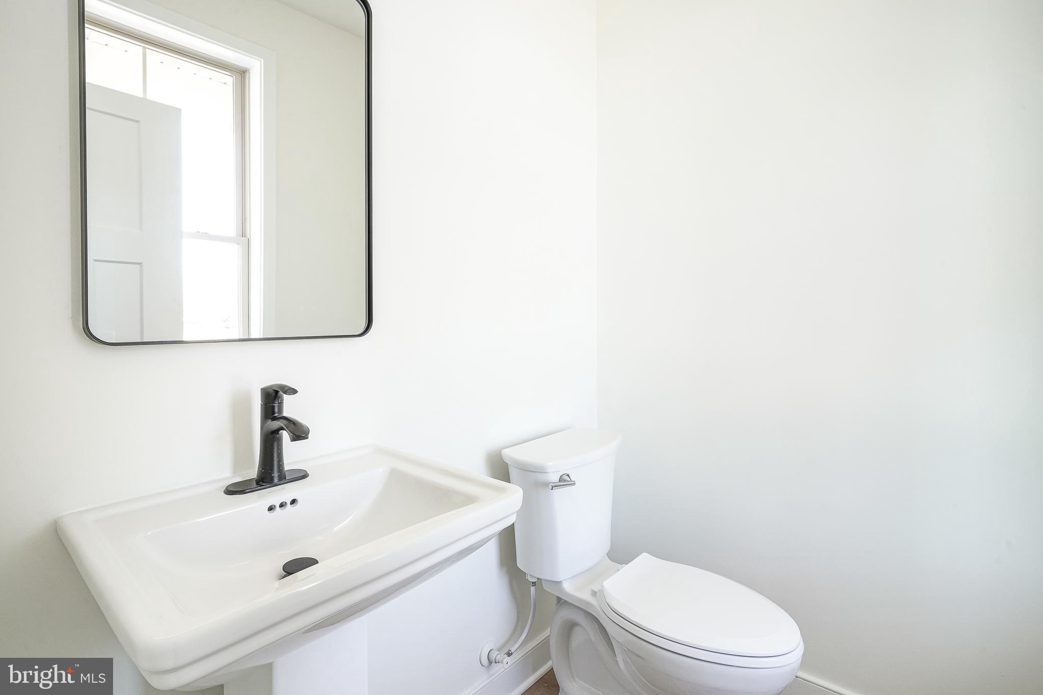 35 West Cohawkin Road Clarksboro, NJ 08020 - Photo 11 of 30 a white toilet sitting next to a bathroom sink