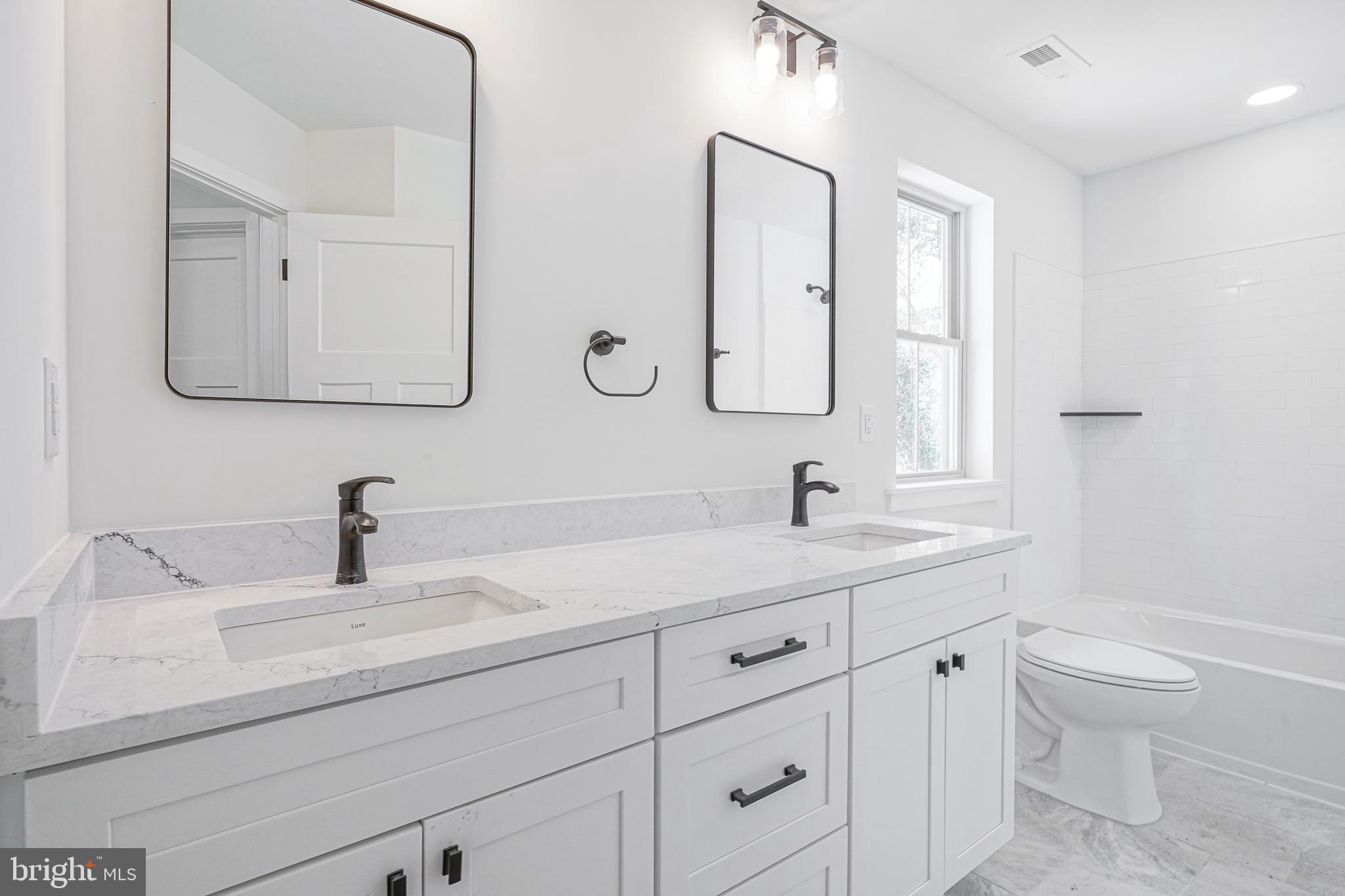 35 West Cohawkin Road Clarksboro, NJ 08020 - Photo 18 of 30 a bathroom with a toilet sink and mirror