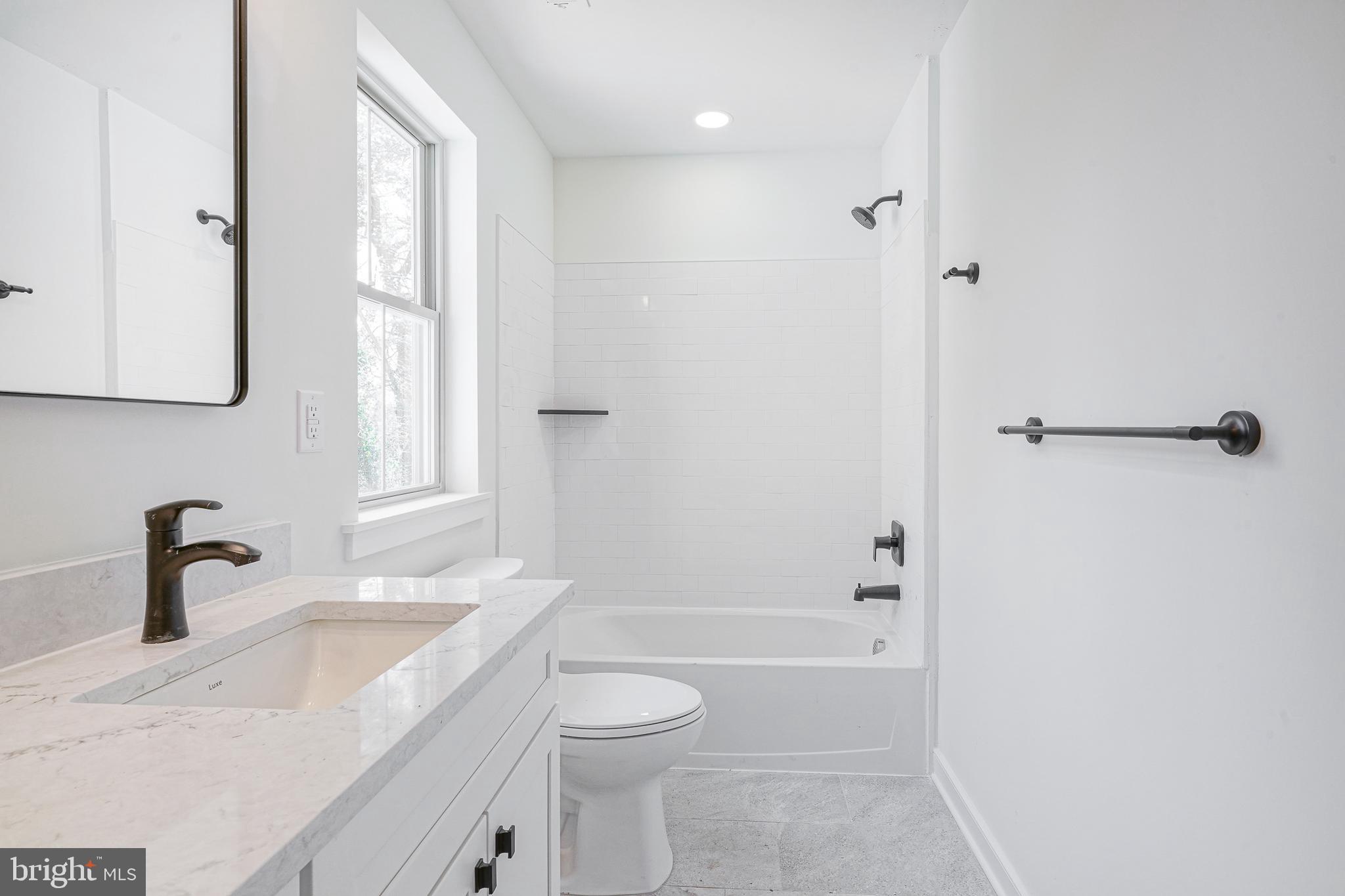 35 West Cohawkin Road Clarksboro, NJ 08020 - Photo 19 of 30 a bathroom with a granite countertop sink a toilet and shower