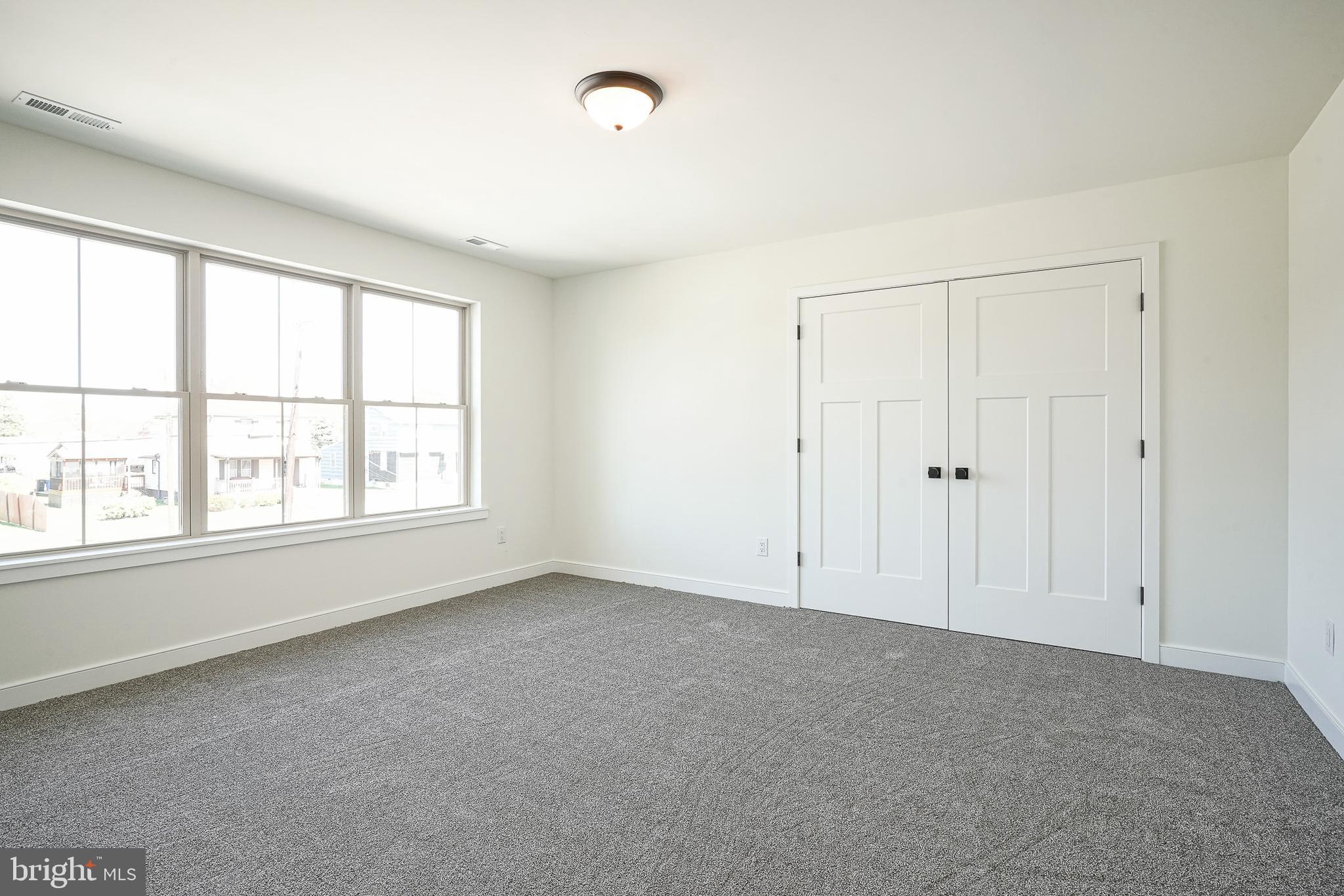 35 West Cohawkin Road Clarksboro, NJ 08020 - Photo 20 of 30 an empty room with a empty space and windows