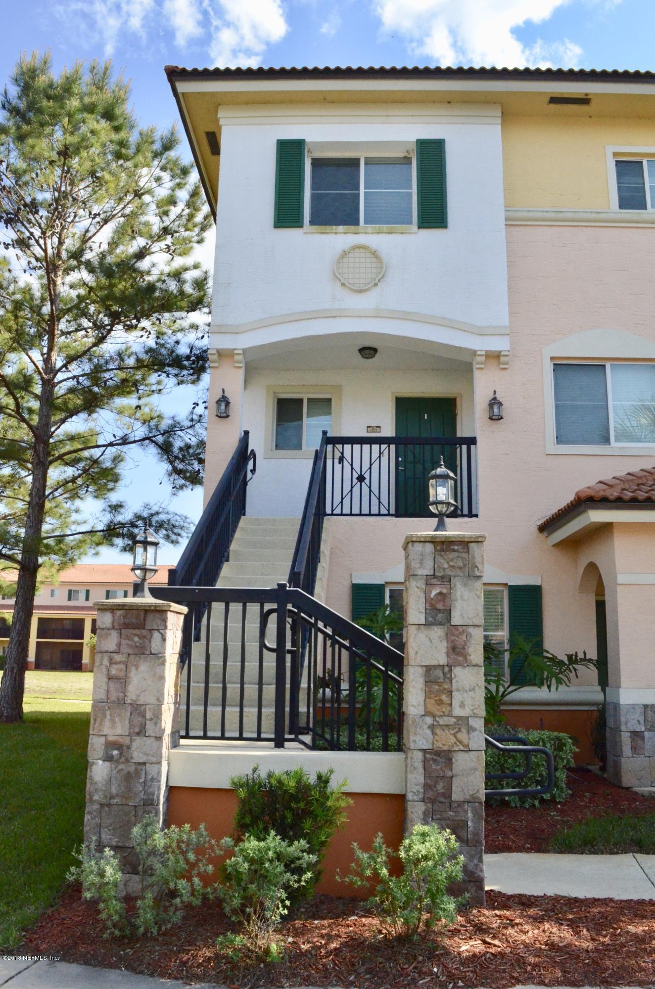 9745 Touchton Road, Unit 1821 Jacksonville, FL 32246 - Photo 1 of 33 a front view of a house with a yard