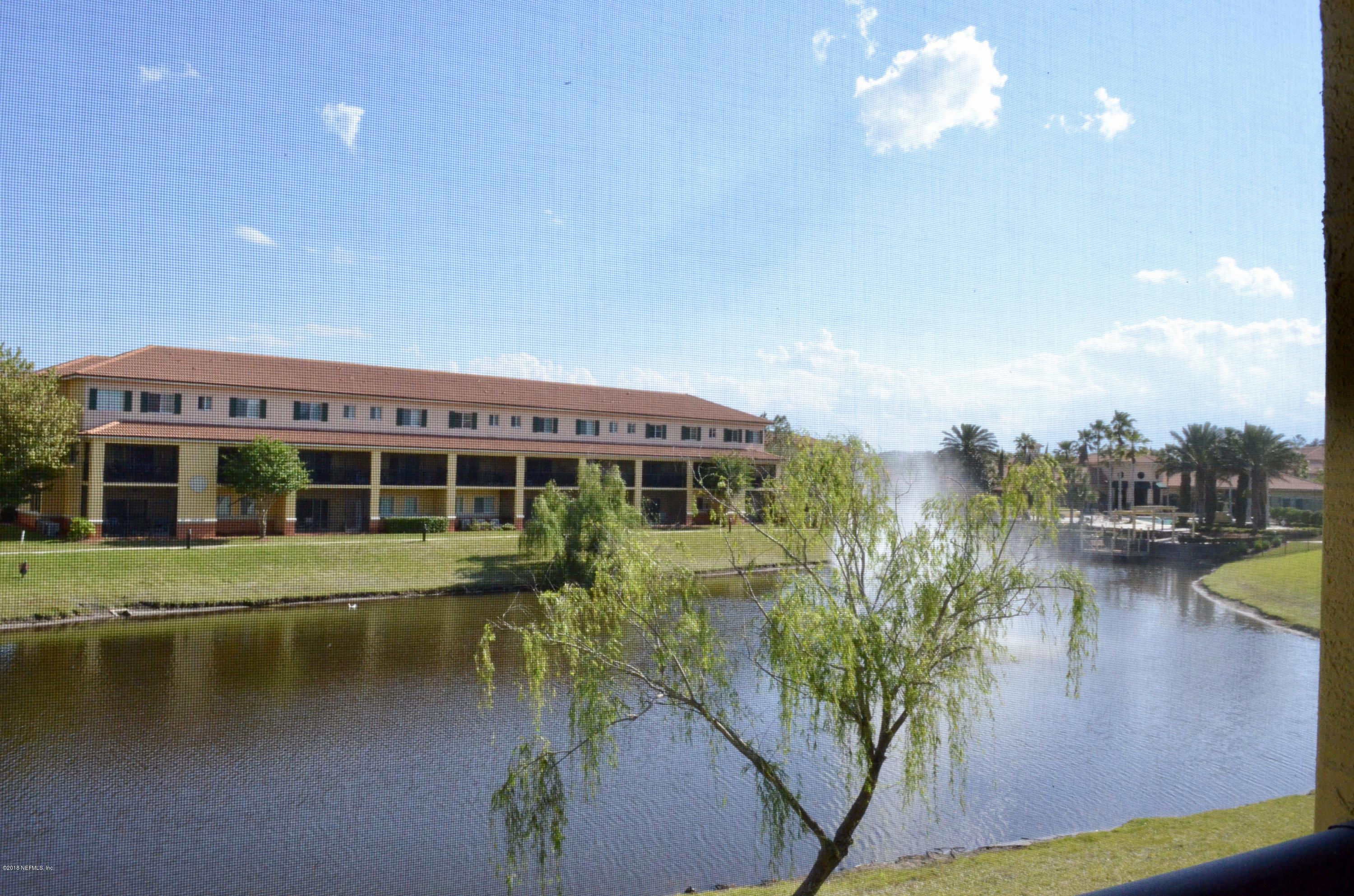 9745 Touchton Road, Unit 1821 Jacksonville, FL 32246 - Photo 14 of 33 a view of a lake with a building in front of it