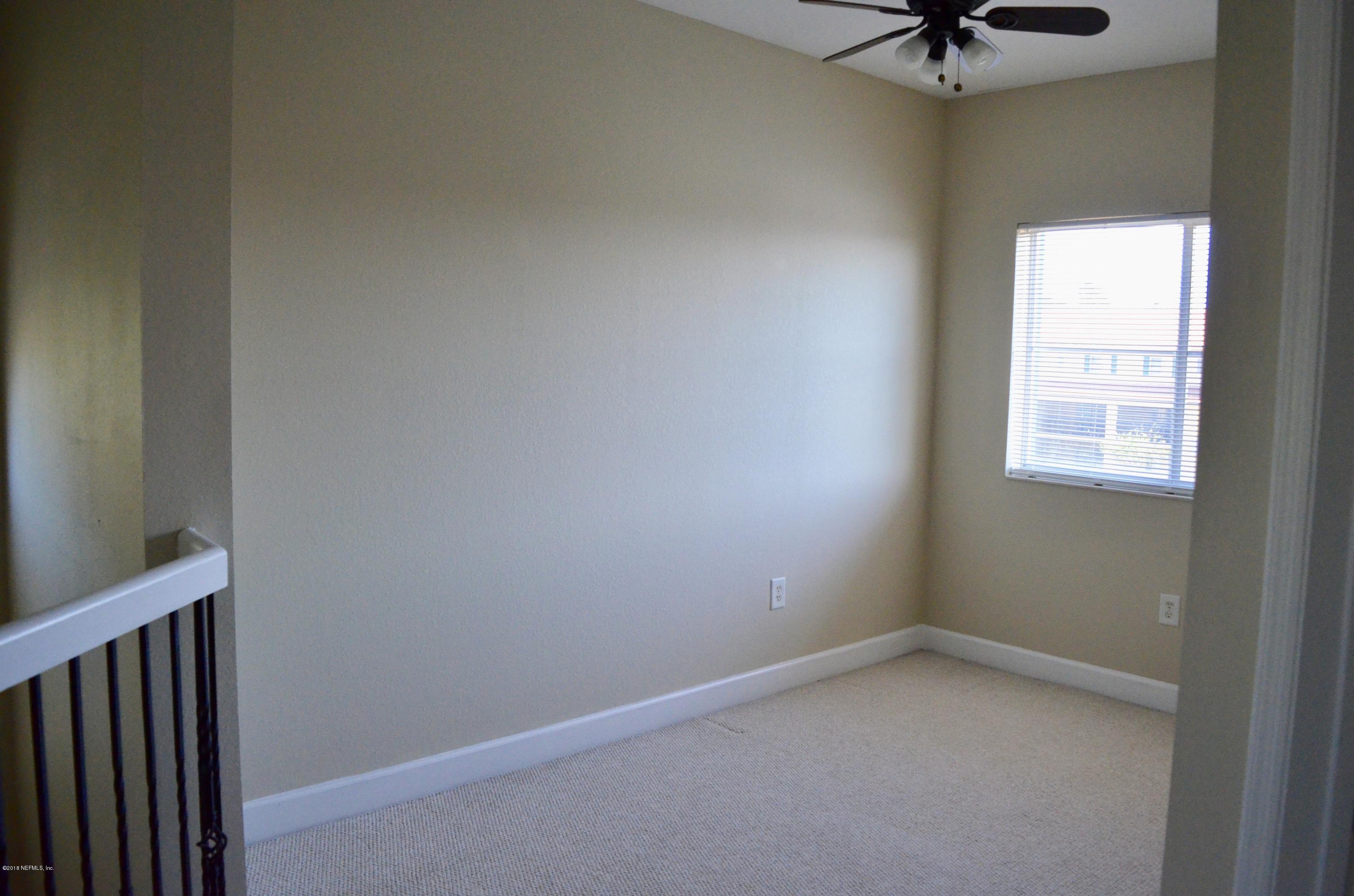 9745 Touchton Road, Unit 1821 Jacksonville, FL 32246 - Photo 18 of 33 an empty room with a window