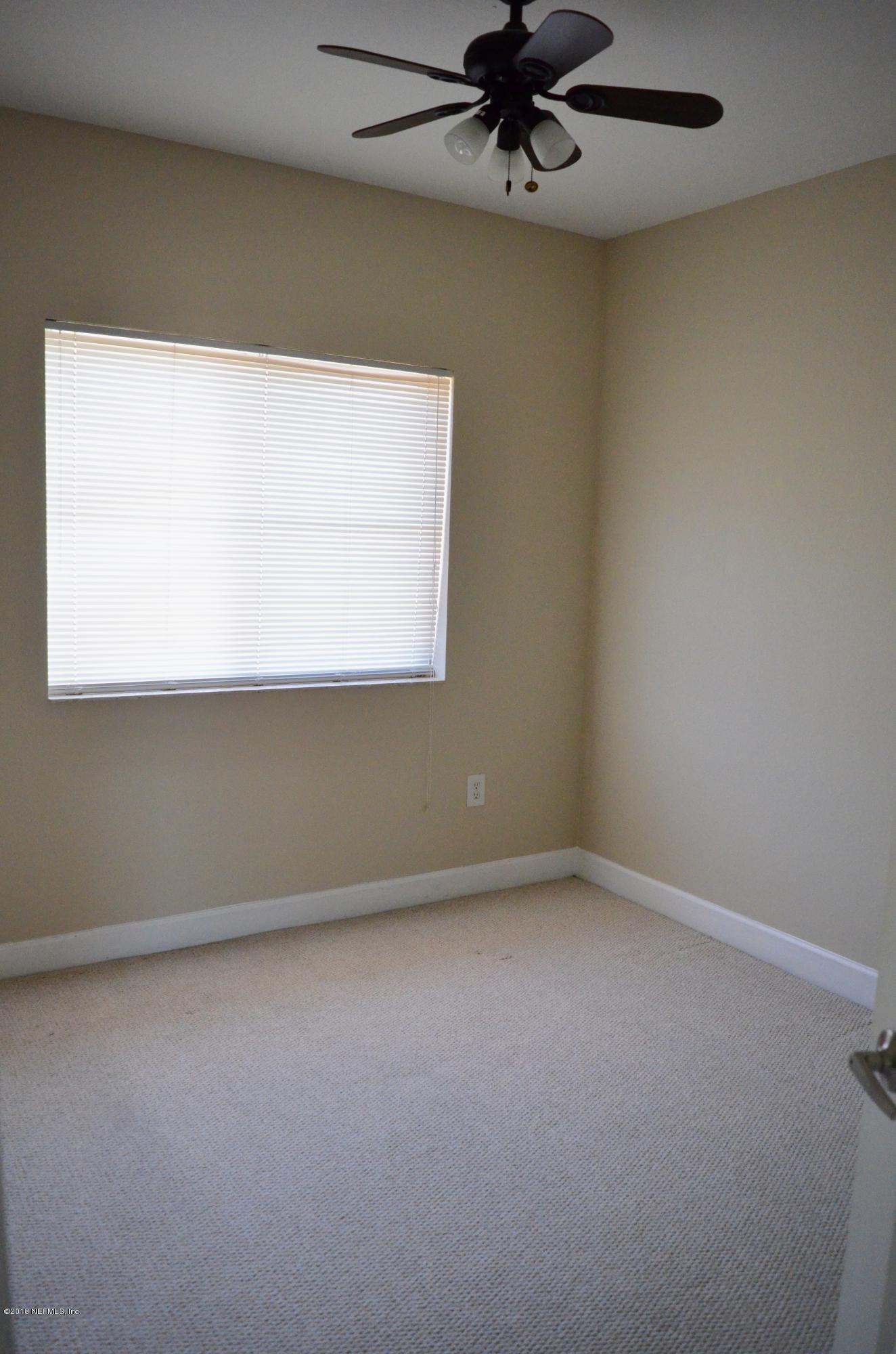 9745 Touchton Road, Unit 1821 Jacksonville, FL 32246 - Photo 19 of 33 an empty room with a window