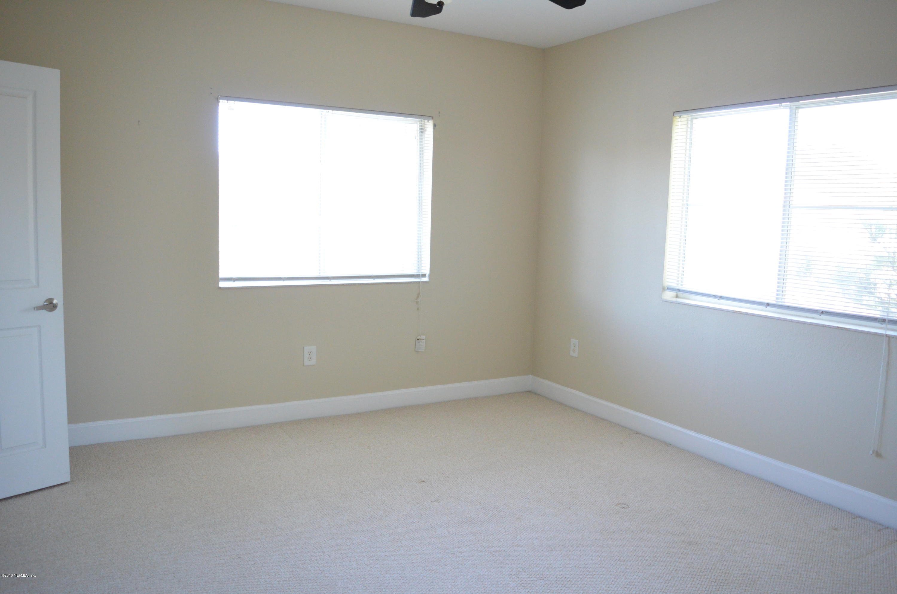 9745 Touchton Road, Unit 1821 Jacksonville, FL 32246 - Photo 21 of 33 an empty room with a window