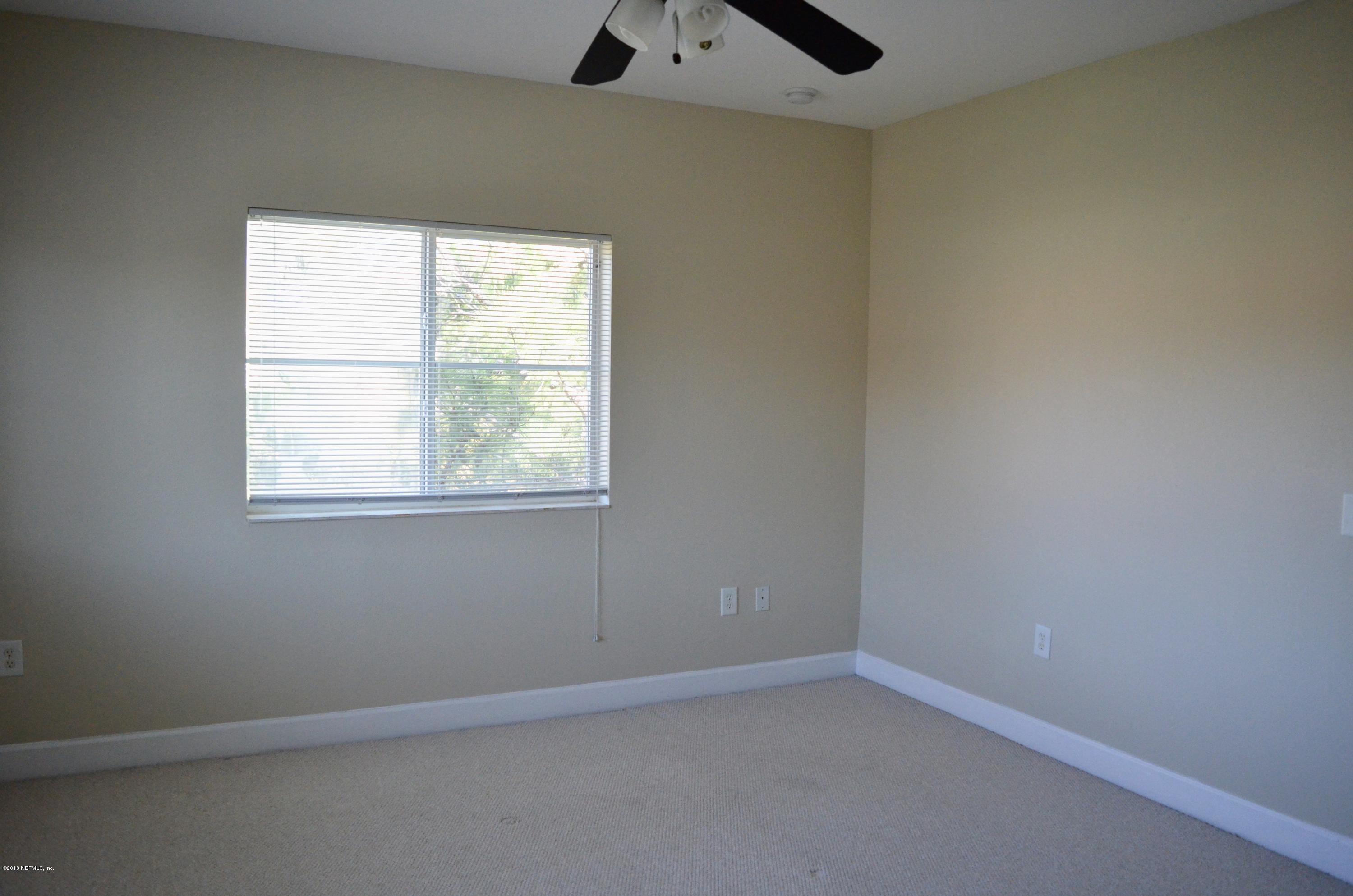 9745 Touchton Road, Unit 1821 Jacksonville, FL 32246 - Photo 28 of 33 an empty room with a window