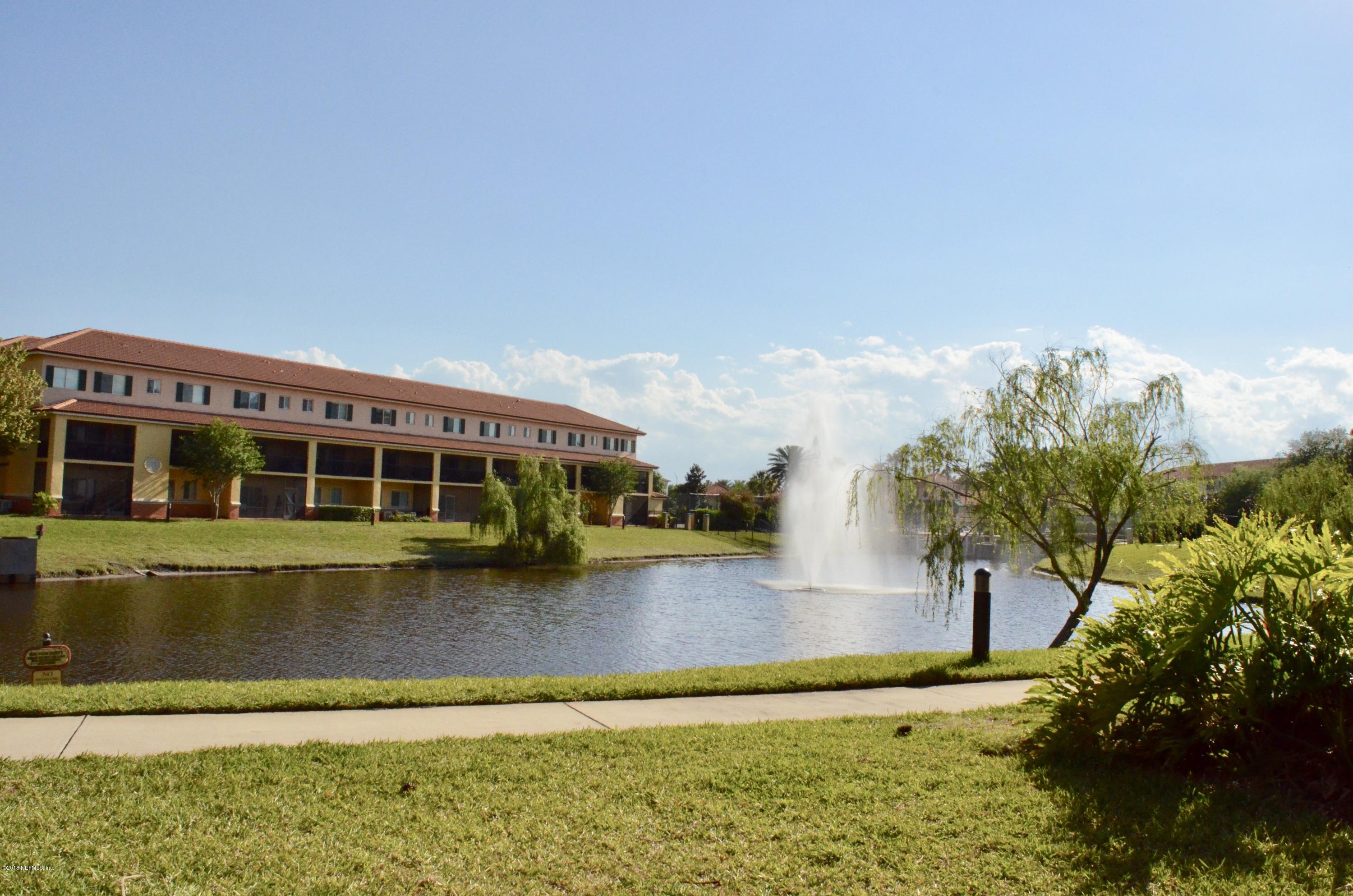 9745 Touchton Road, Unit 1821 Jacksonville, FL 32246 - Photo 31 of 33 a view of a swimming pool with an outdoor space and seating area