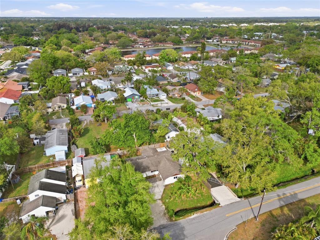 4576 Bliss Road Sarasota, FL 34233 - Photo 36 of 40 an aerial view of residential houses with outdoor space and trees
