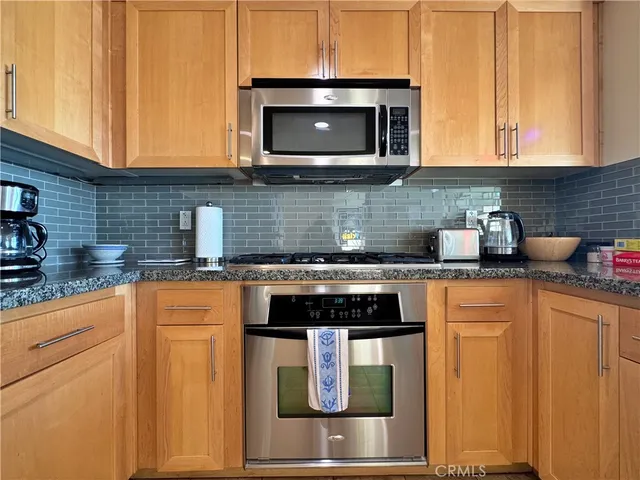 a kitchen with a sink and a window