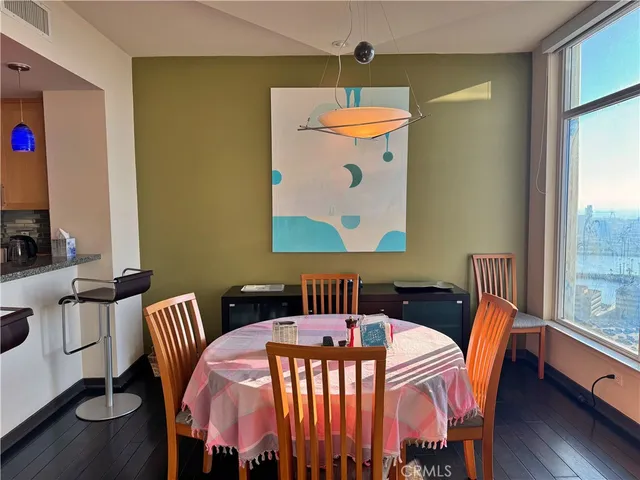 a very nice looking dining room with a table and chairs