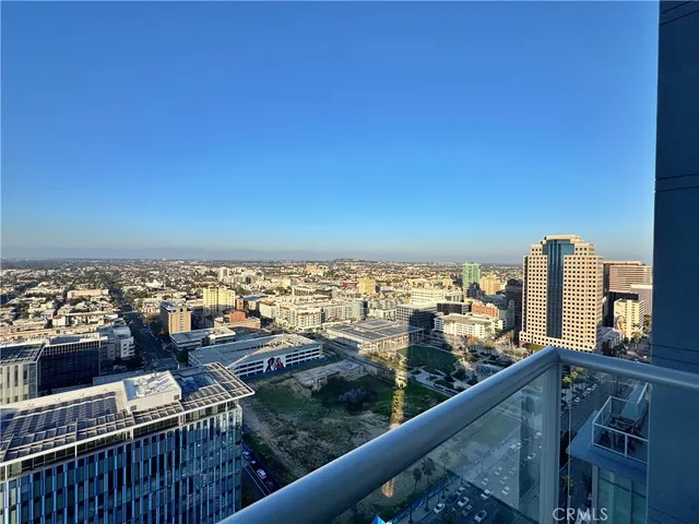 a bedroom with a large bed and a balcony view