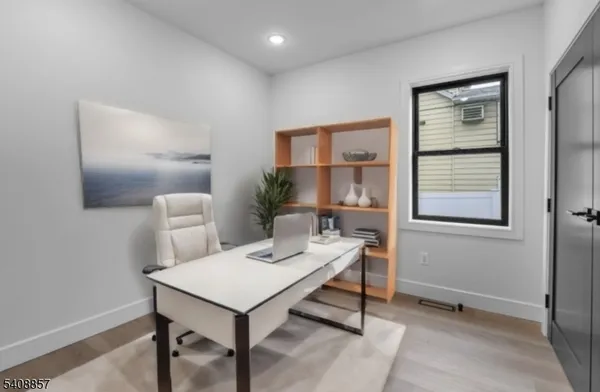 a view of a livingroom with furniture and window