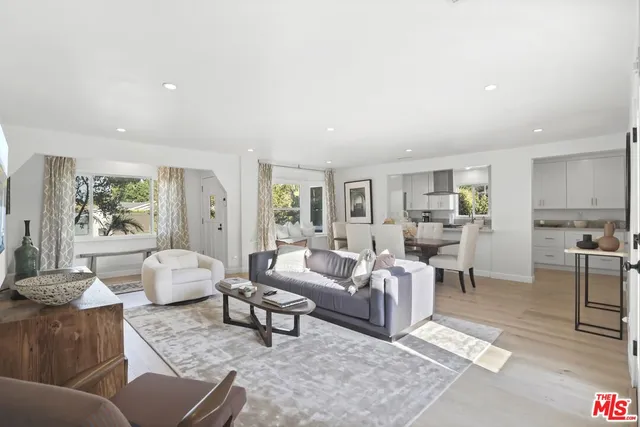 a living room with furniture window and flat screen tv