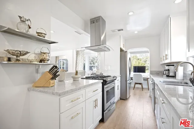 a bathroom with a double vanity sink a mirror a shower and bathtub
