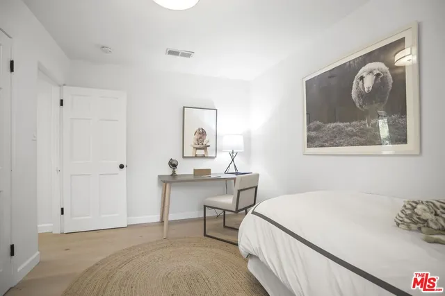 a view of house with backyard and sitting area