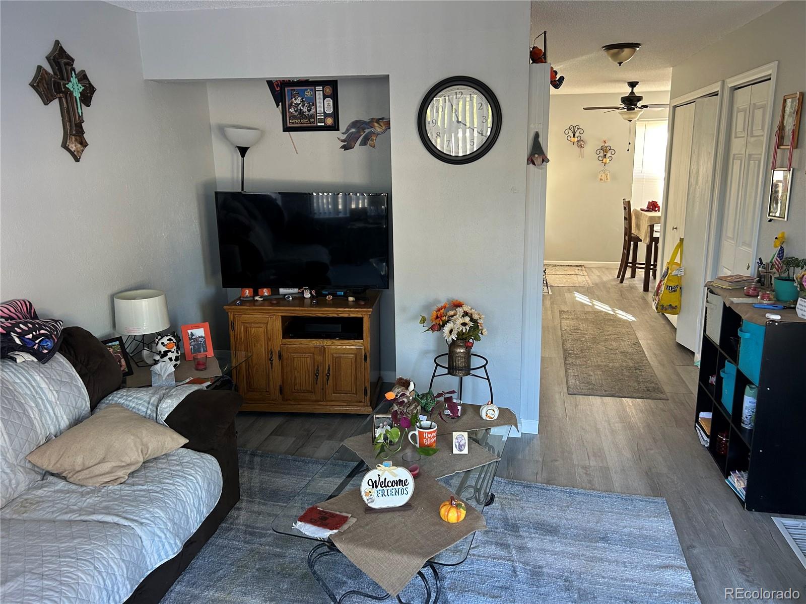 7980 Chase Circle, Unit F Arvada, CO 80003 - Photo 12 of 16 a living room with furniture and a flat screen tv