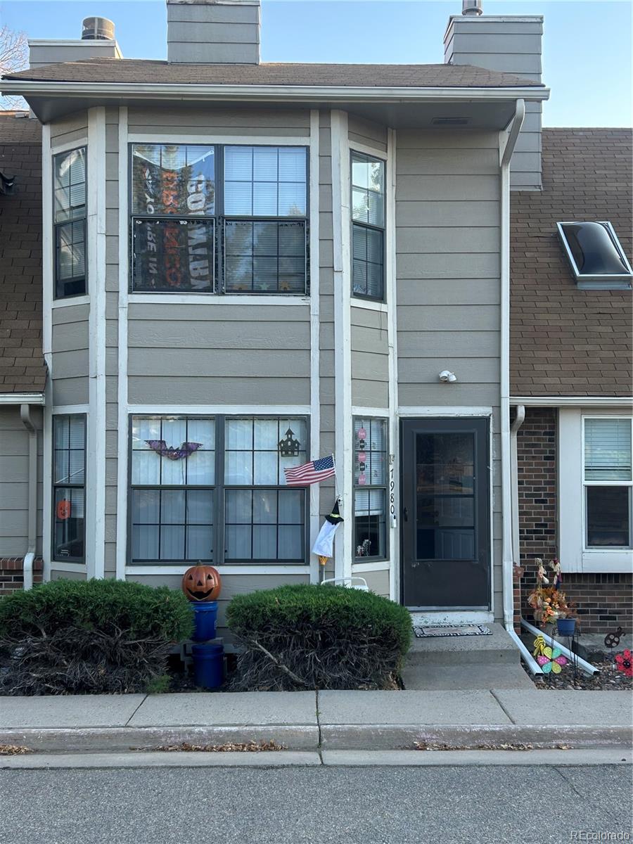 7980 Chase Circle, Unit F Arvada, CO 80003 - Photo 16 of 16 a front view of a house with garden
