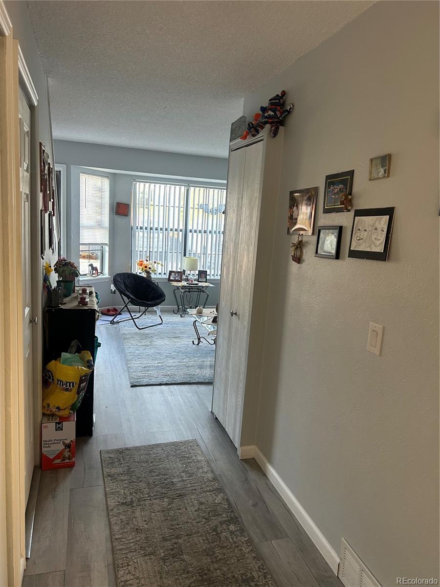 7980 Chase Circle, Unit F Arvada, CO 80003 - Photo 4 of 16 a living room with furniture and a window