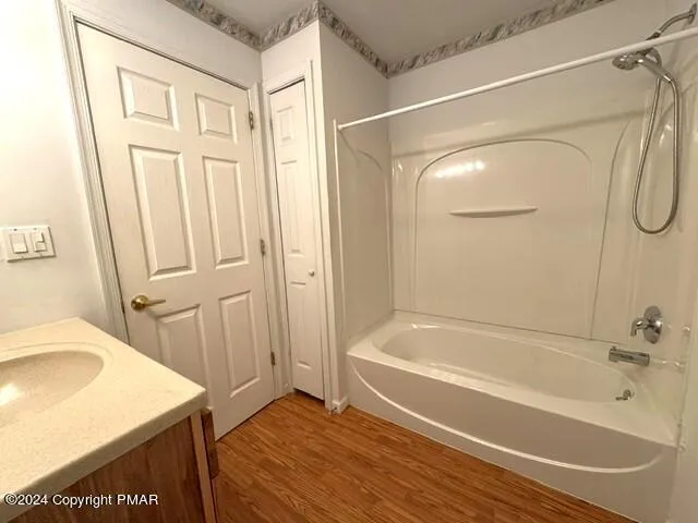 a view of a house with a big yard and large trees