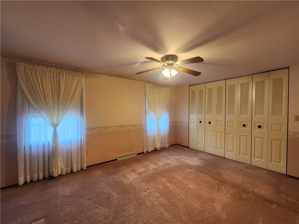 191 Mary Reed Road Baden, PA 15005 - Photo 22 of 28 an empty room with fan and windows