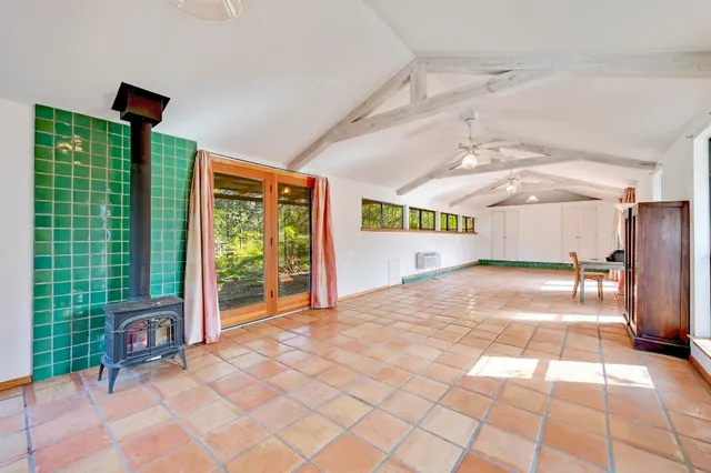 a bathroom with a bathtub and shower