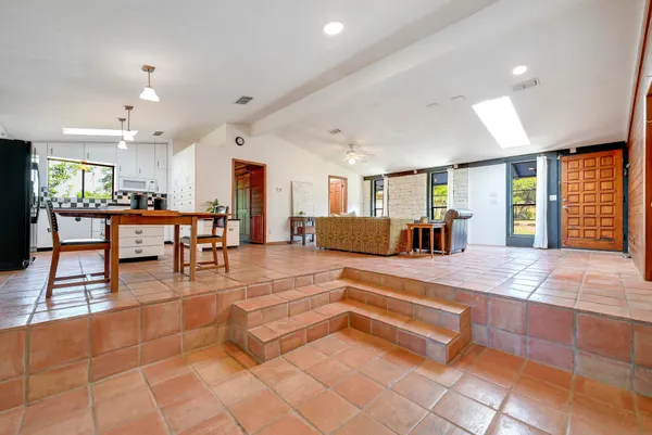 a view of a lobby with furniture and a large window