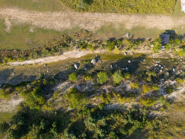 an aerial view of a house with a yard