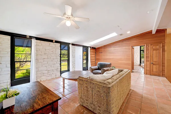 a living room with furniture and a window