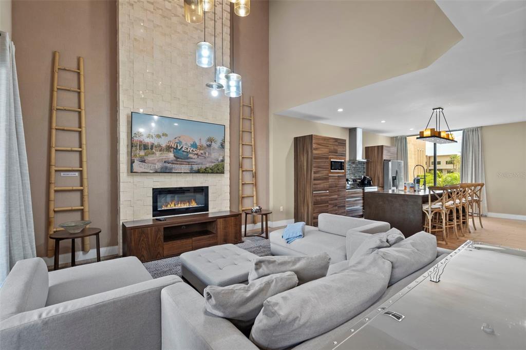 3099 Rockefeller Way Kissimmee, FL 34747 - Photo 13 of 54 a living room with furniture and a fireplace