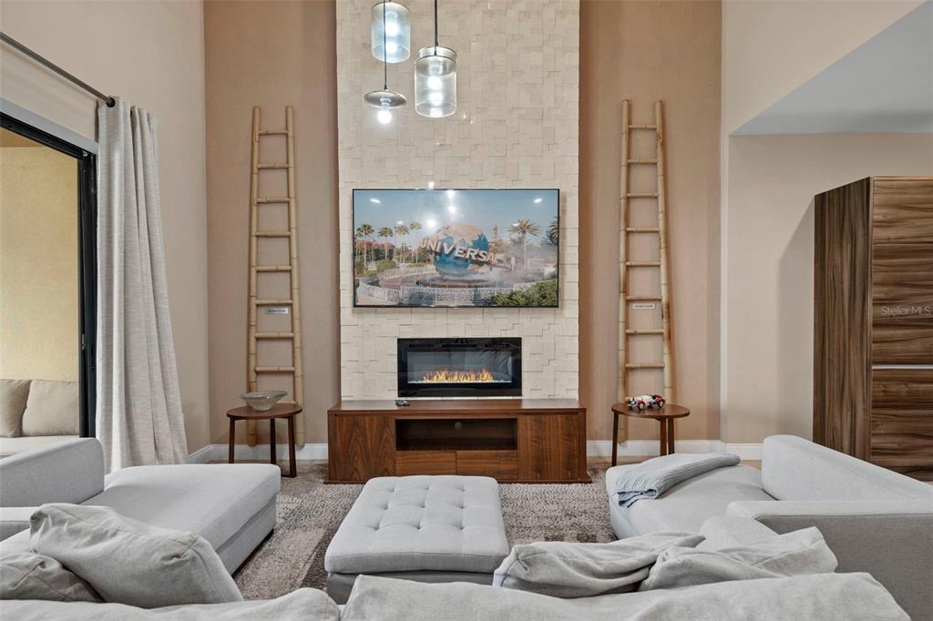 3099 Rockefeller Way Kissimmee, FL 34747 - Photo 14 of 54 a living room with furniture and a fireplace