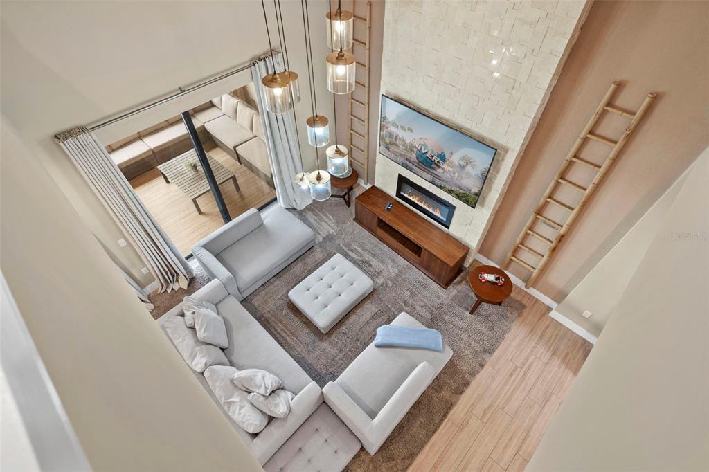 3099 Rockefeller Way Kissimmee, FL 34747 - Photo 15 of 54 view of a living room with furniture and wooden floor