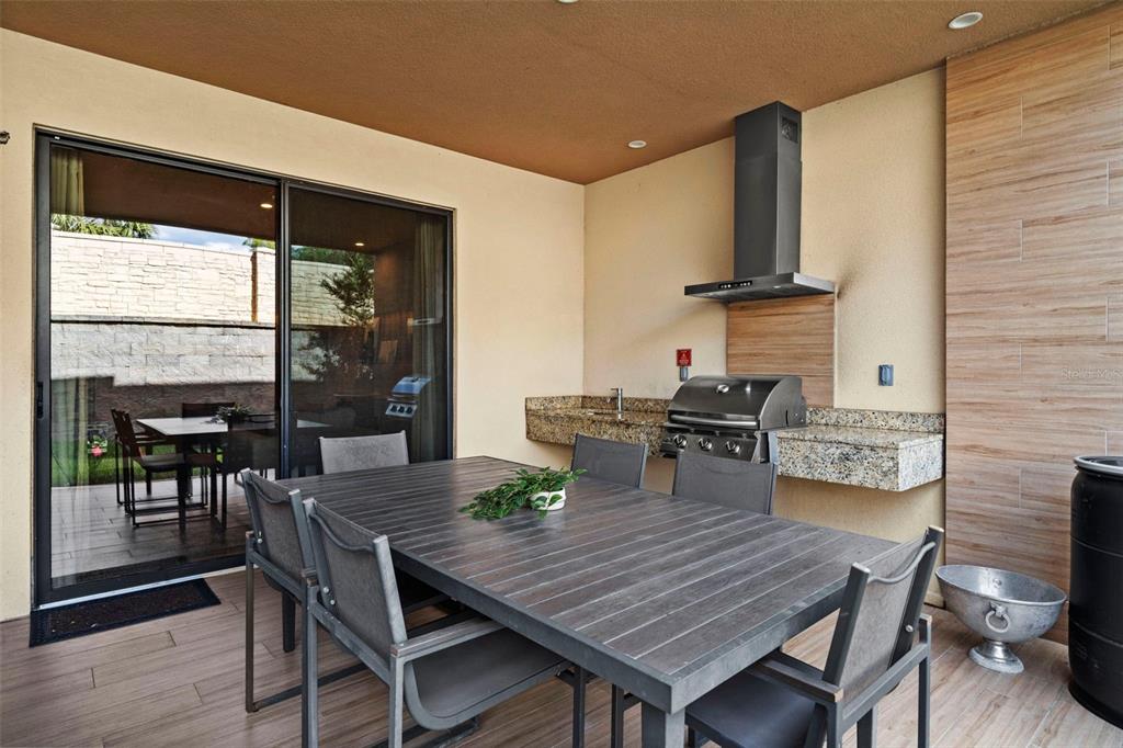 3099 Rockefeller Way Kissimmee, FL 34747 - Photo 16 of 54 a dining room with furniture and wooden floor