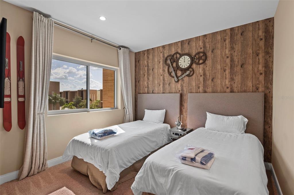 3099 Rockefeller Way Kissimmee, FL 34747 - Photo 19 of 54 a bedroom with two beds and two windows