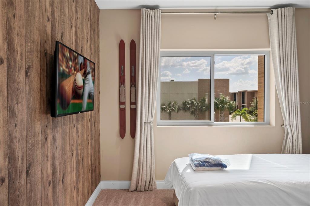 3099 Rockefeller Way Kissimmee, FL 34747 - Photo 20 of 54 a bedroom with a bed and a window