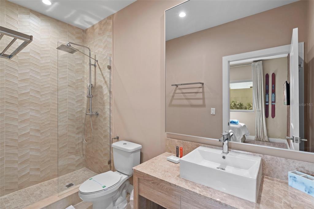 3099 Rockefeller Way Kissimmee, FL 34747 - Photo 21 of 54 a bathroom with a sink toilet and shower