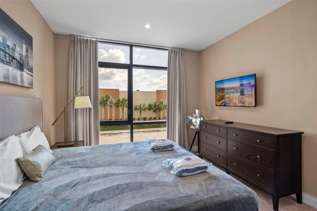 3099 Rockefeller Way Kissimmee, FL 34747 - Photo 23 of 54 a bed room with a bed and a large window