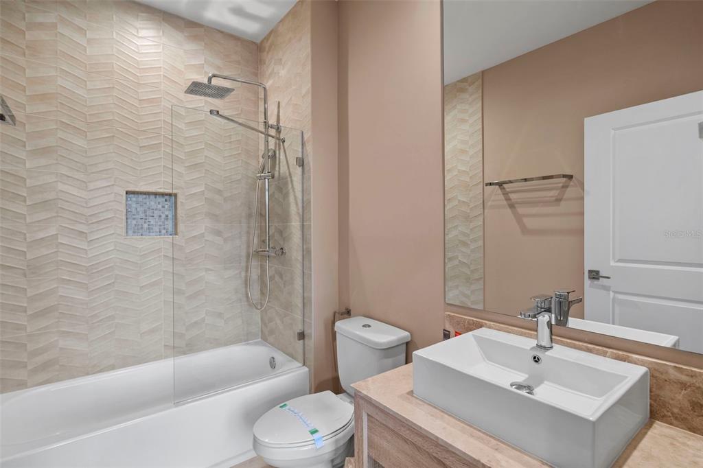 3099 Rockefeller Way Kissimmee, FL 34747 - Photo 24 of 54 a bathroom with a sink toilet and shower