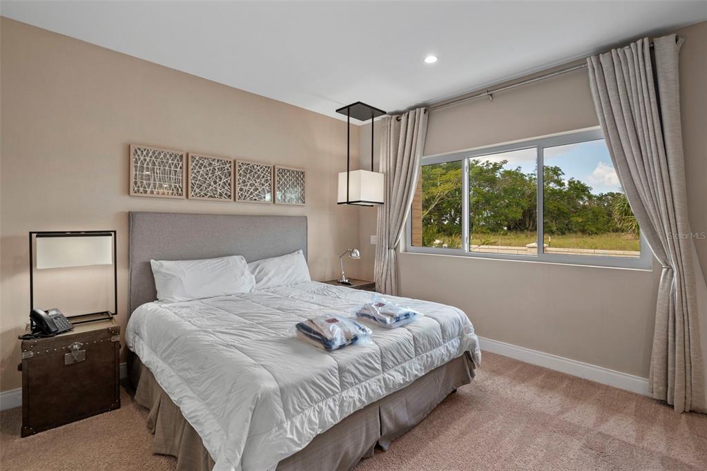 3099 Rockefeller Way Kissimmee, FL 34747 - Photo 26 of 54 a bedroom with a large bed and a window