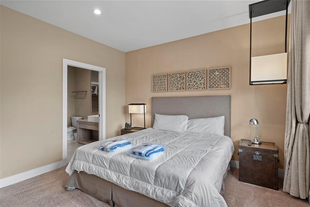 3099 Rockefeller Way Kissimmee, FL 34747 - Photo 27 of 54 a bedroom with a bed and a painting on the wall