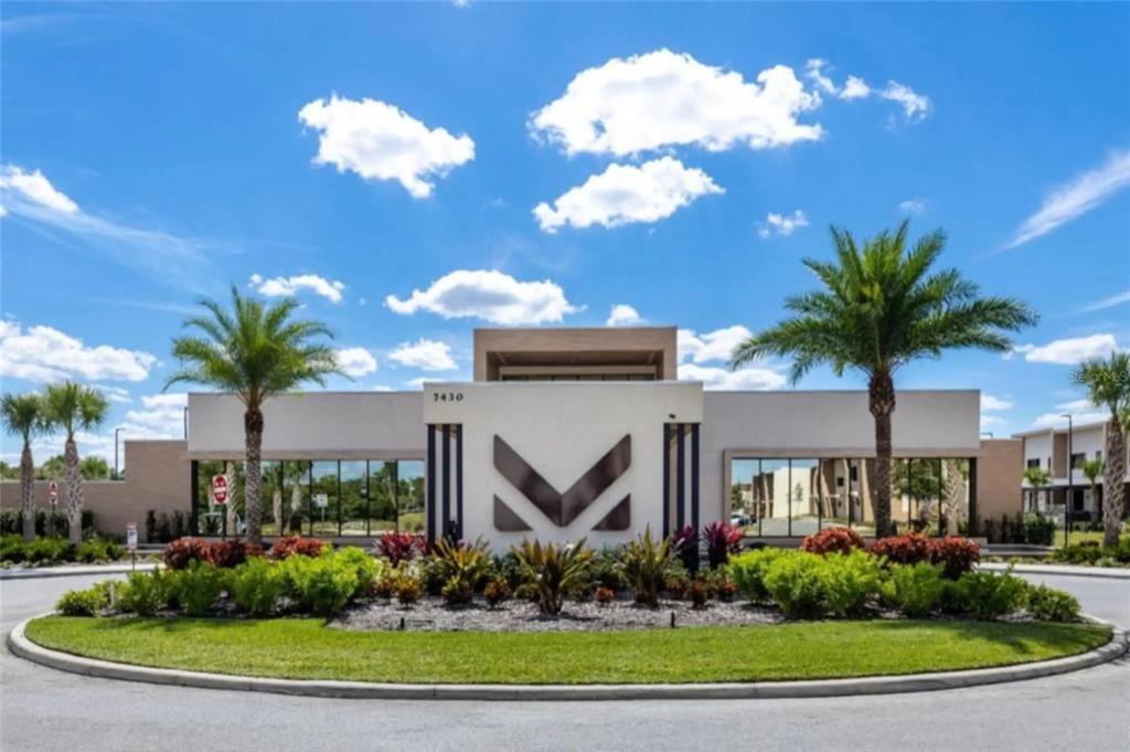3099 Rockefeller Way Kissimmee, FL 34747 - Photo 38 of 54 a front view of a house with a yard and a fountain