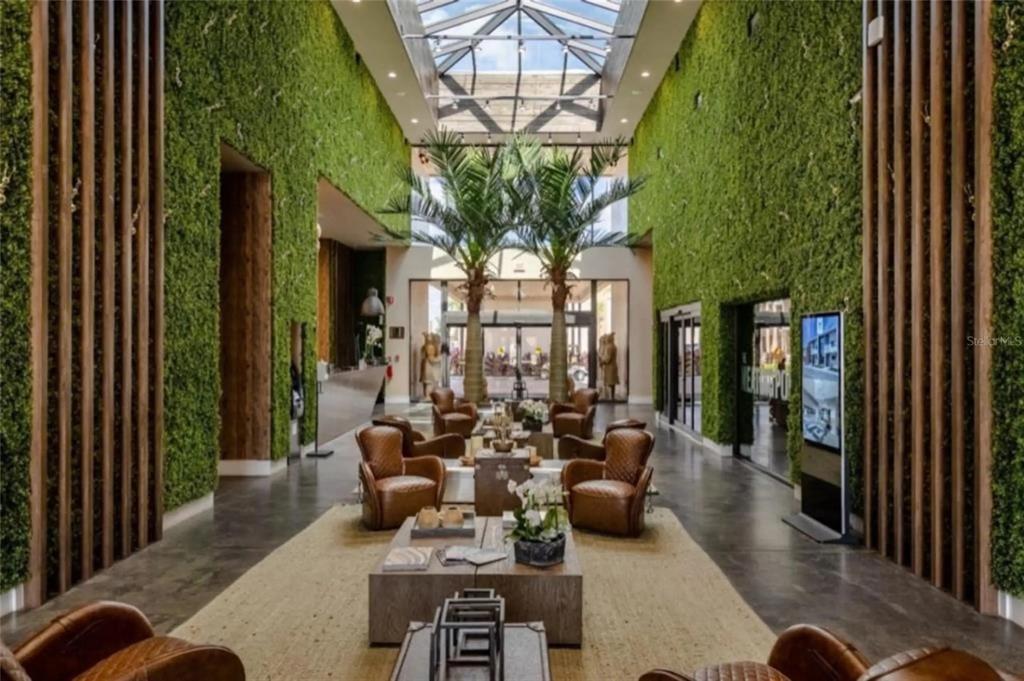 3099 Rockefeller Way Kissimmee, FL 34747 - Photo 40 of 54 a living room with furniture and a large window