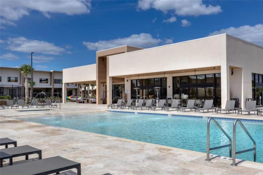 3099 Rockefeller Way Kissimmee, FL 34747 - Photo 46 of 54 a patio with a table and chairs and couches