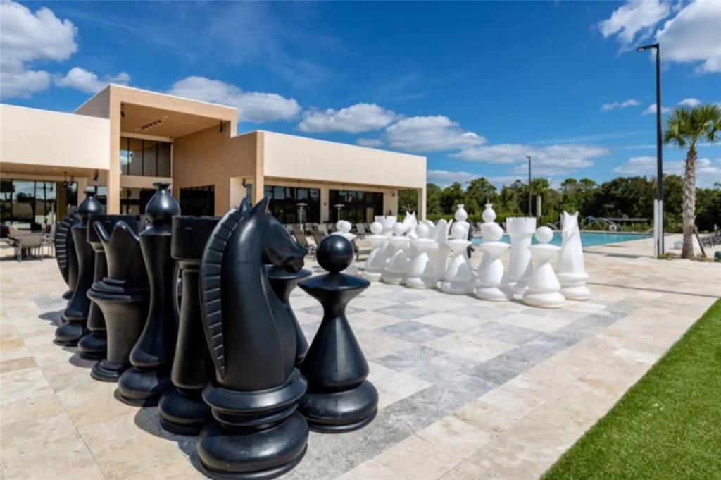 3099 Rockefeller Way Kissimmee, FL 34747 - Photo 52 of 54 a view of a chairs and tables in patio